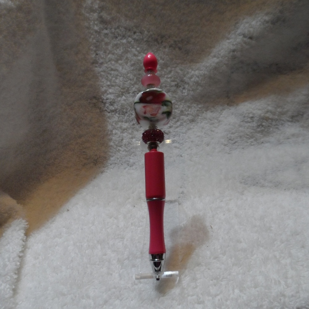 Handcrafted hot pink beaded ballpoint ink writing